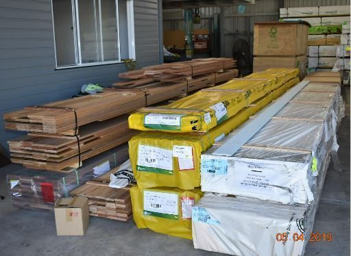 Flooring and building supply stock inside the Budget Timbers shed